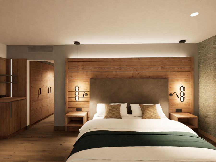 Junior Suite im Hotel Churfürstenhof: Doppelbett vor Holz-Kopfteil mit Pendelleuchten (Visualisierung)