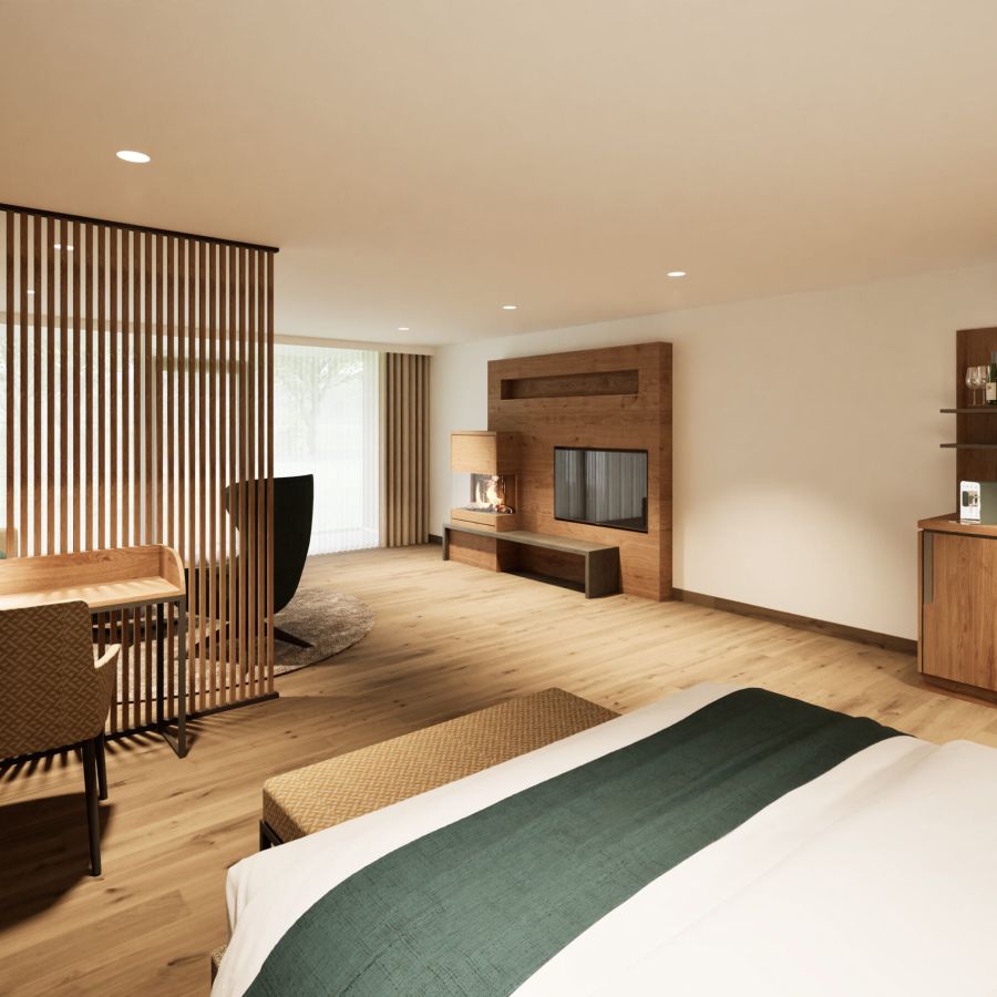 Wohnbereich der Junior Suite im Hotel Churfürstenhof mit Schreibtisch, Holzlamellenwand und TV-Board