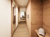 Garderobenbereich der Junior Suite im Hotel Churfürstenhof mit Einbauschrank aus Holz, Spiegel und Ablagen