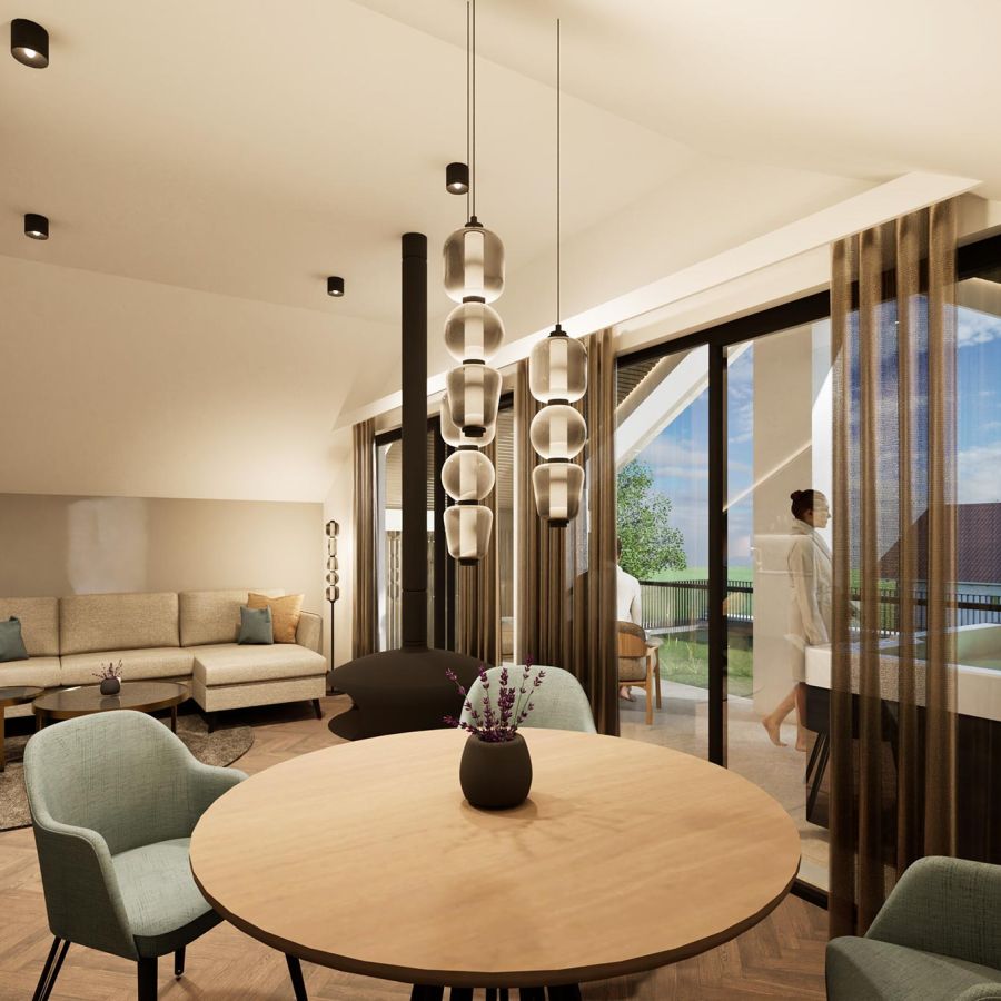 Esstisch und Wohnzimmer in der Penthouse Suite des Hotel Churfürstenhof Bad Birnbach