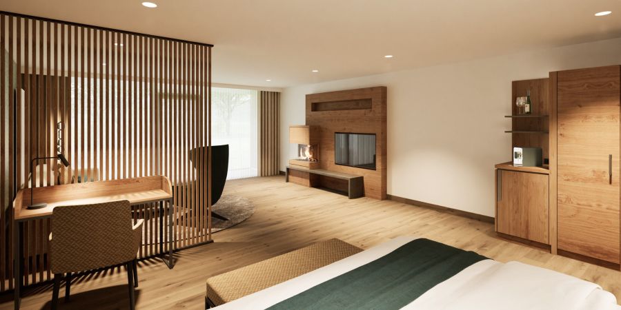 Wohnbereich der Junior Suite im Hotel Churfürstenhof mit Schreibtisch, Holzlamellenwand und TV-Board